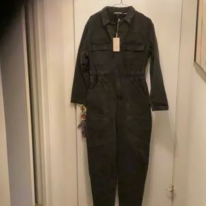Woman’s long sleeve denim jumpsuit.  Black